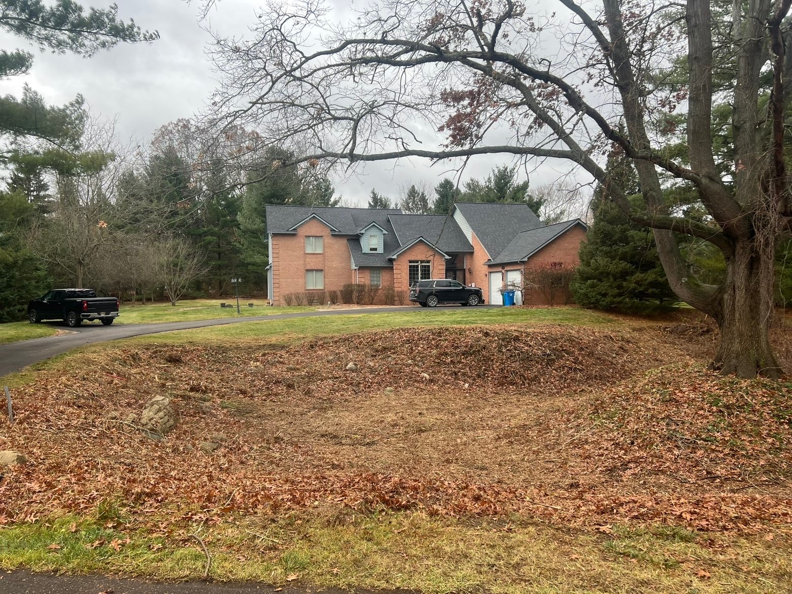 Cleared fire pit area after property cleanup — Bemis