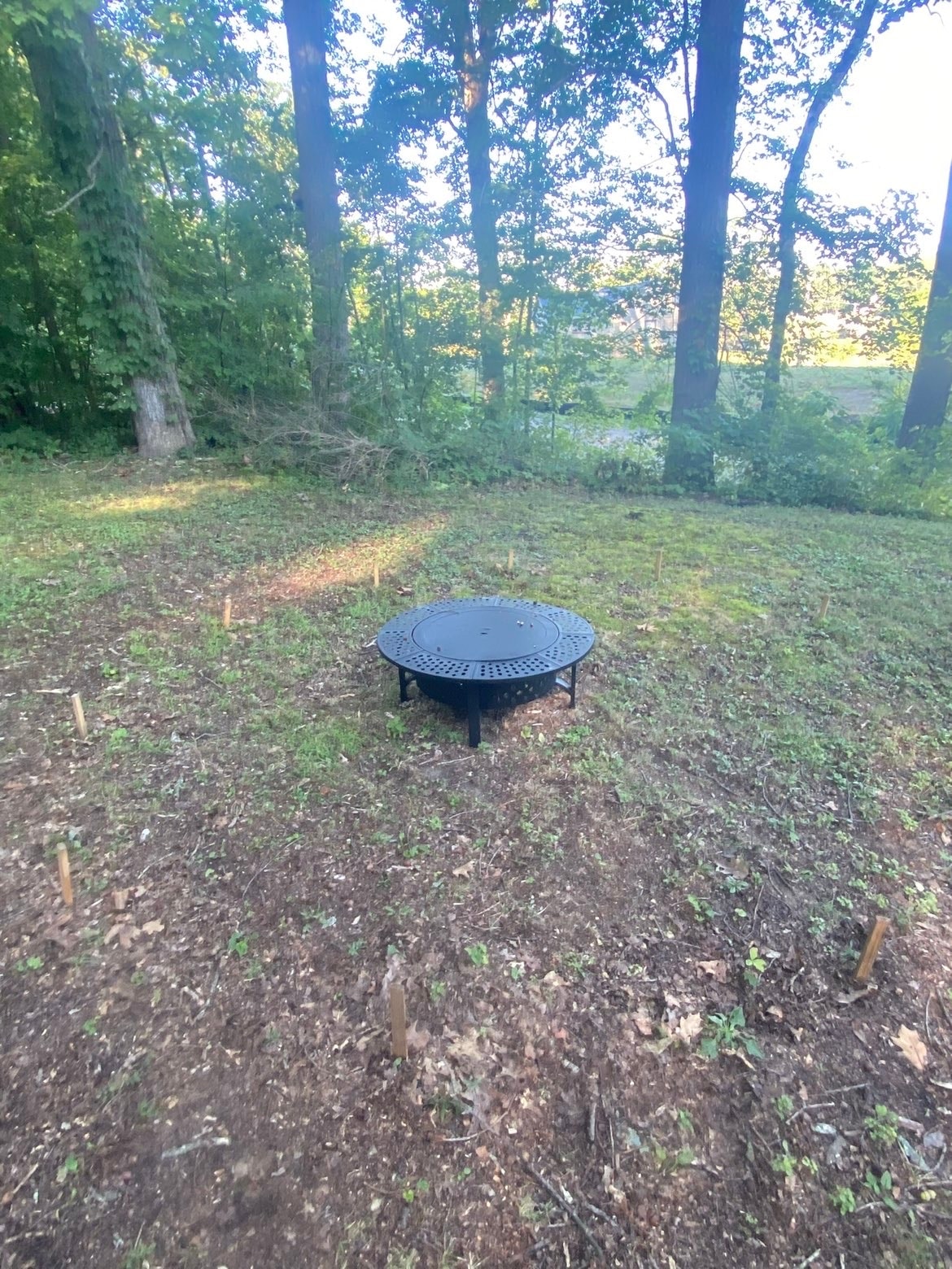 Fire pit area cleared and prepped for hardscape install — Bemis